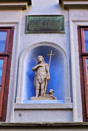The good Shepherd. Small statue of Jesus with a lamb on an old house in Prague, Czech Republicのeditorial素材