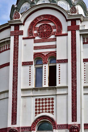 Facade of art nouveau building in Belgrade, Serbia, vertical in red and whiteの写真素材