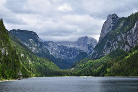 Scenic view of Vorderer Gosausee on a cloudy dayの写真素材