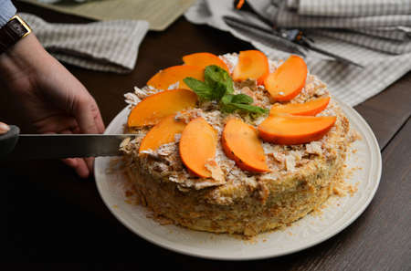 Peach slices and mint leaves on a pieの写真素材