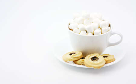 Dark chocolate with marshmallows heaped on top with extra sweets. の写真素材