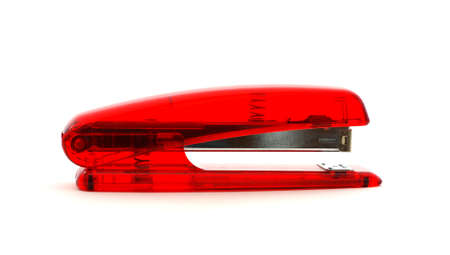 Red translucent office stapler with visible mechanism inside. の写真素材