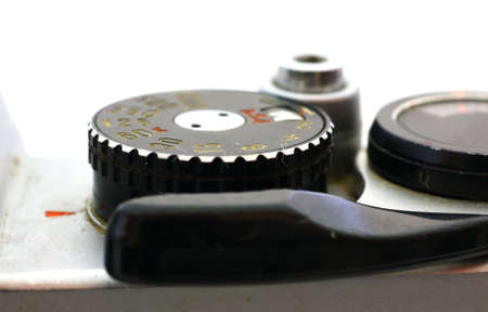 A vintage camera with close view of shutter speed dial. 