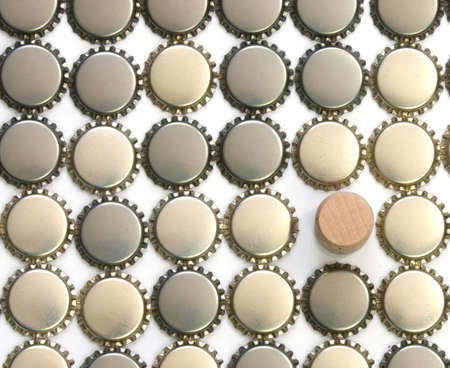 Beer bottle caps with wine cork の写真素材