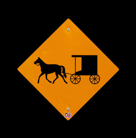 Horse and buggy sign with black backgroundの写真素材