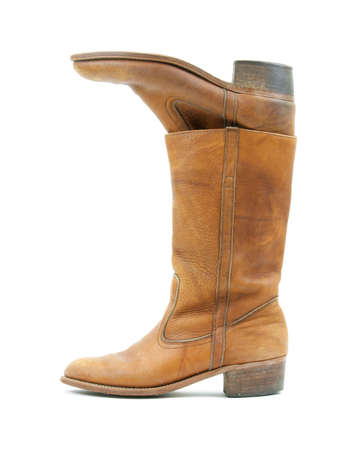 Old leather boots inside one another の写真素材