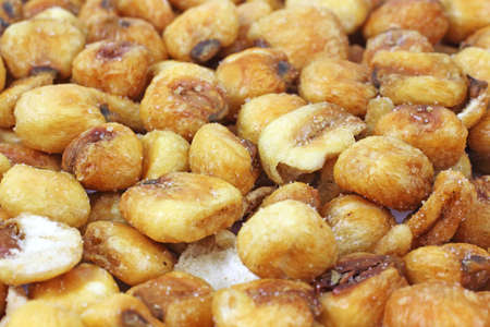 A layer of several roasted and salted corn nut snack food.の写真素材