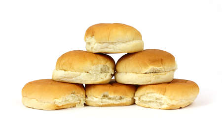 A group of six hamburger buns arranged on a white background.の写真素材