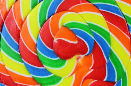 A very close view of the brilliant colors in a carnival sized lollypop.の写真素材