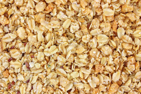 Close view of a layer of organic hemp and flax seed granola cereal.の写真素材