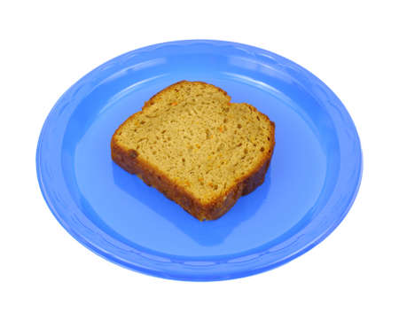 A slice of carrot cake on a blue plastic picnic dish.の写真素材