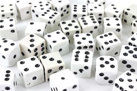 A large group of playing dice on a white background.