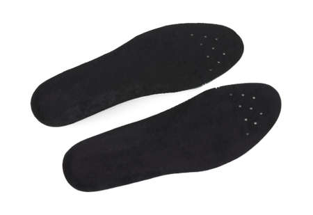 A pair of new insoles for men's shoes on a white background.の写真素材