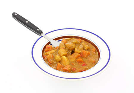A serving of hot Thai spicy vegetables on a plate with a fork.の写真素材