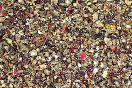 A very close view of several types of peppercorns that have been ground for seasoning.の写真素材