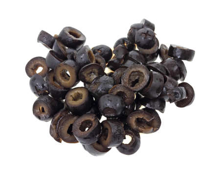 A small group of sliced ripe olives on a white background.の写真素材