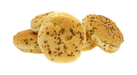 Several fresh onion bulkie rolls on a white background.