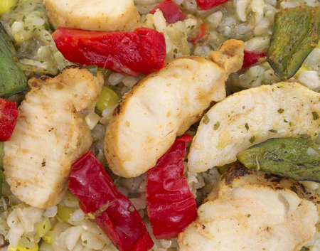 A close view of small pieces of chicken with vegetables.の写真素材