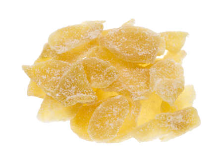 Top view of several slices of sugared crystallized ginger slices on a white background の写真素材