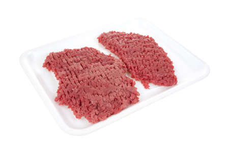Two fresh raw beef cubed steaks on a white meat tray の写真素材