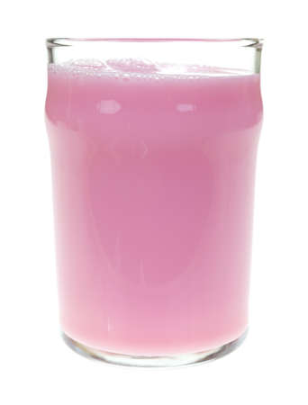 A clear glass filled with strawberry flavored nonfat skim milk on a white background の写真素材