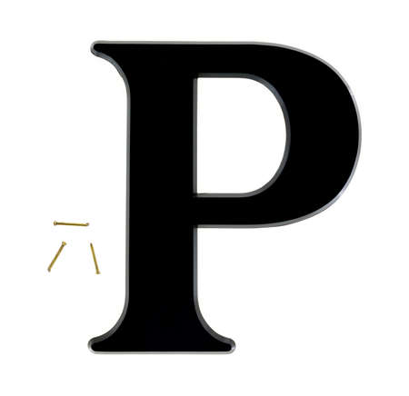 A large black house letter P with three small brass nails for mounting on a white background.の写真素材