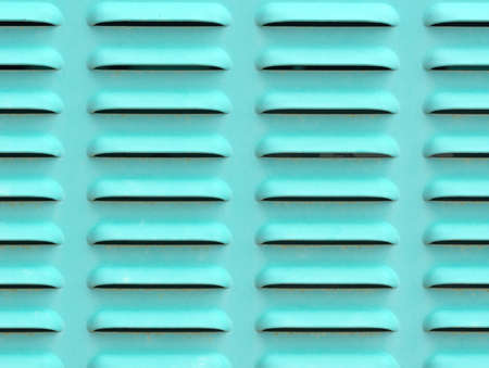 Close view of air vents on the side of a large industrial generator.の写真素材