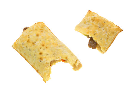 A bitten pocket bread breakfast sandwich with a portion to the side on a white background 