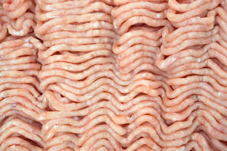 A very close view of ground chicken.