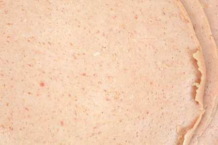 A very close view of German baloney cold cuts.