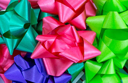 A very close view of assorted hues of Christmas bows.の写真素材