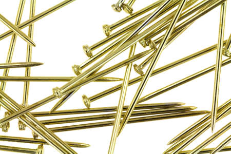 A close view of gold sequin pins for arts and crafts on a white background.