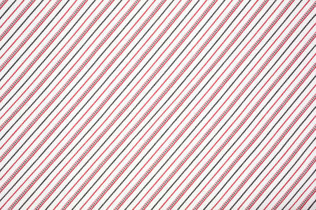 Rows of black and red stripes on white fabric.