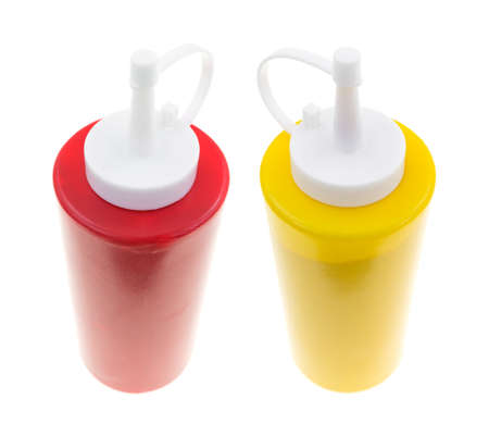 A bottle of ketchup and mustard on a white background.の写真素材