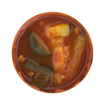 Top view of cooked zucchini in a tomato sauce in an opened can isolated on a white background.の写真素材