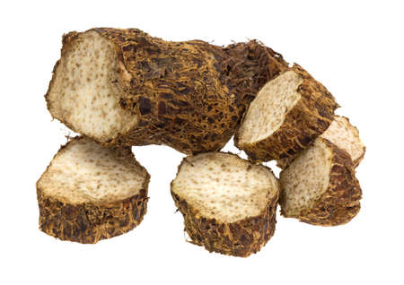 A fresh Malanga with several pieces sliced off isolated on a white background.の写真素材