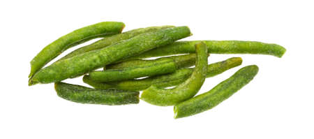 A group of green beans that have been dehydrated and salted on a white background.の写真素材