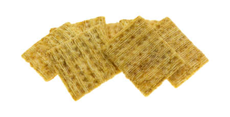 A serving of a whole grain wheat crackers isolated on a white background.の写真素材