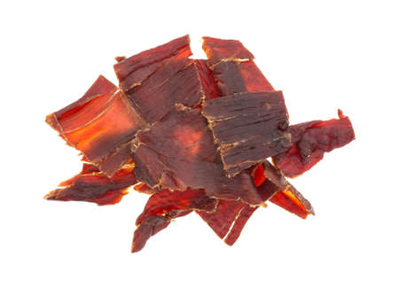Top view of several slices of hardwood smoked beef jerky isolated on a white background.の写真素材