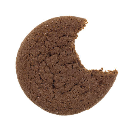 Top view of a Dutch cocoa cookie that has been bitten once isolated on a white background.