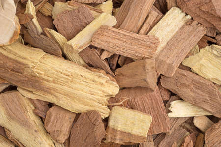 Close view of mesquite wood smoking chips for flavoring barbecue and grilled foods.