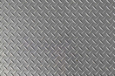 Close view of a galvanized steel plate used for covering construction holes.の写真素材