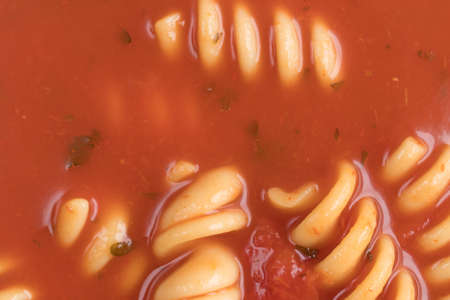 Very close view of rotini tomato soup.の写真素材