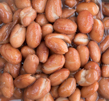 Very close view of shelled beans in liquid.の写真素材