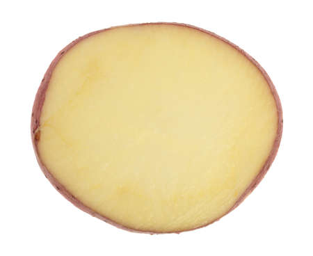 Top view of a single slice of red potato isolated on a white background.の写真素材
