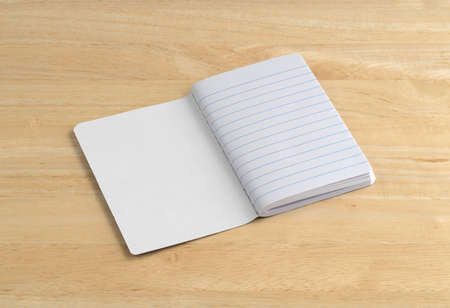 An opened blank notebook on a wood table.