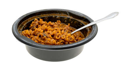 A freshly made bowl of cooked marinara pasta with a fork inserted into the food isolated on a white background.の写真素材