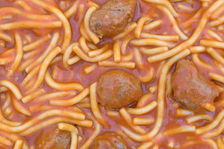 A very close view of canned spaghetti and meatballs.の写真素材