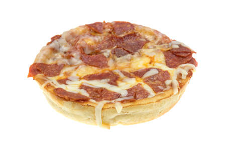 A microwaved personal size pepperoni pizza isolated on a white background.の写真素材