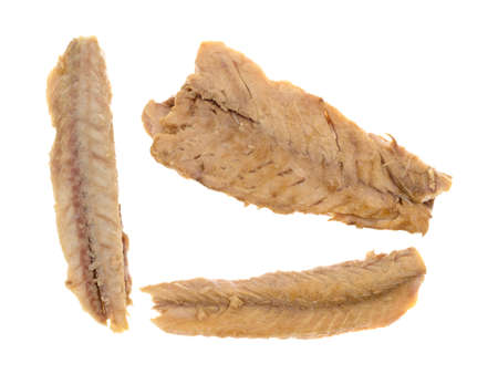 Top view of skinless mackerel fillets on a white background.